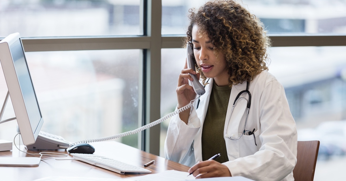 Healthcare professional talking to someone on the phone