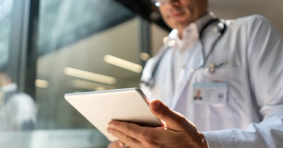 Person looking down at tablet