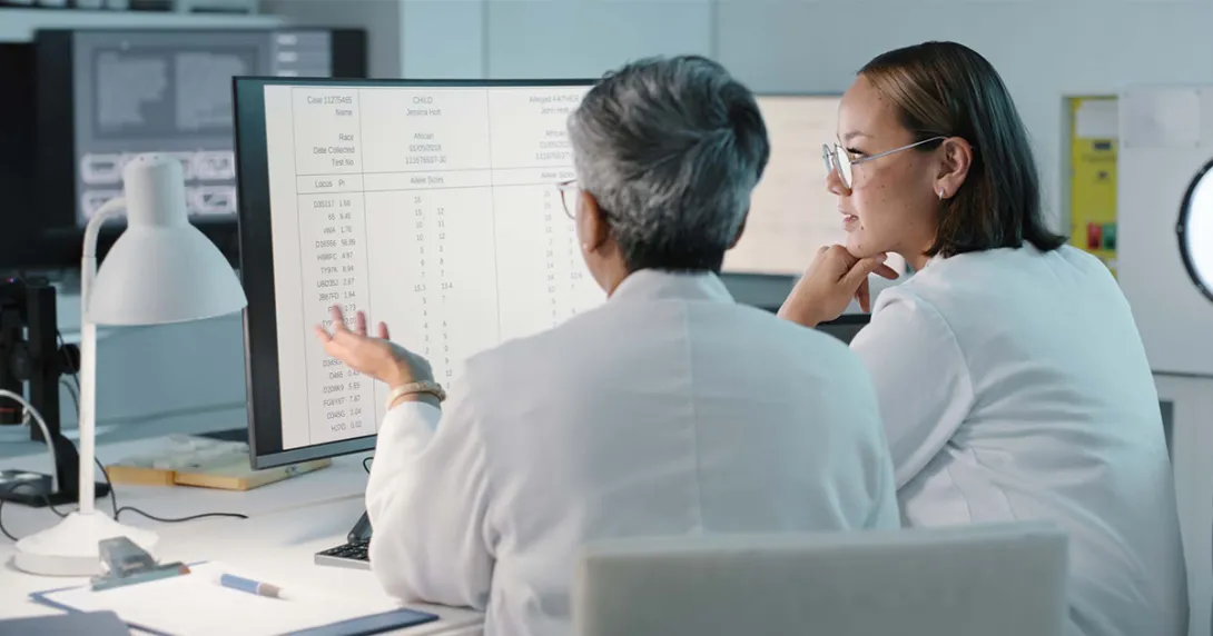 Healthcare workers looking at a spreadsheet on a computer monitor
Healthcare workers looking at a spreadsheet on a computer monitor