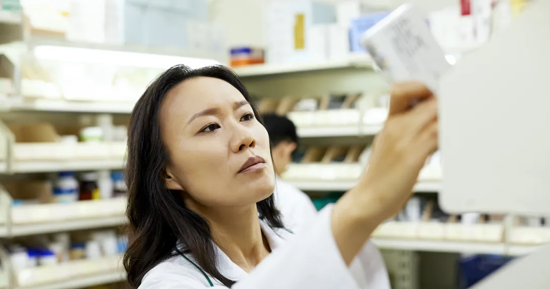 Pharmacist looking at a paper