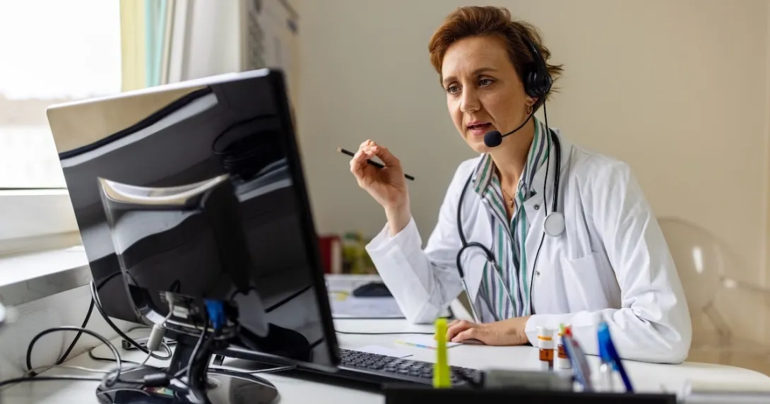 Healthcare professional looking at PC screen